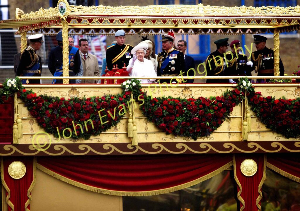 Queen Elizabeth II waves to the crowds at her Thames Diamond Jubilee Pageant, River Thames, 2012