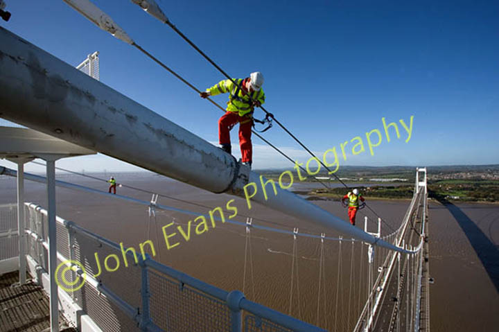 Panoramic shot of workmen carrying out aerial safety checks on the old Severn Bridge between England and Wales.